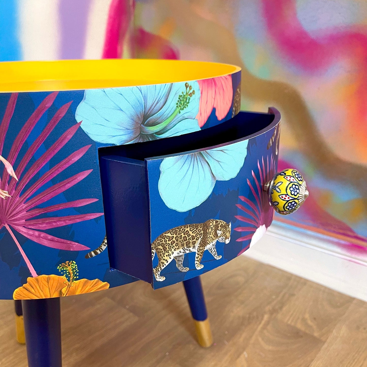 Flocking Fab - Navy Round bedside table with drawer, navy and yellow nightstand with tropical and leopard design.  Blue side table with storage, eclectic table