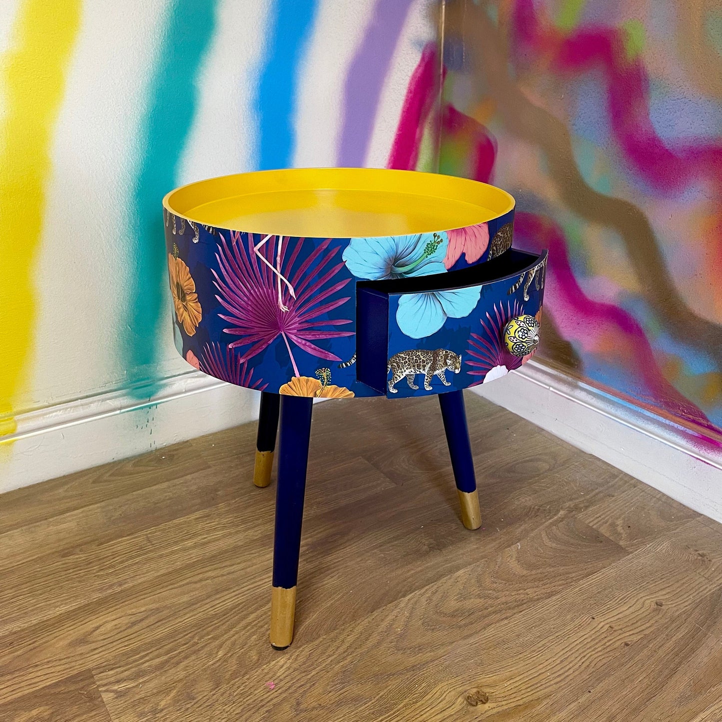 Flocking Fab - Navy Round bedside table with drawer, navy and yellow nightstand with tropical and leopard design.  Blue side table with storage, eclectic table