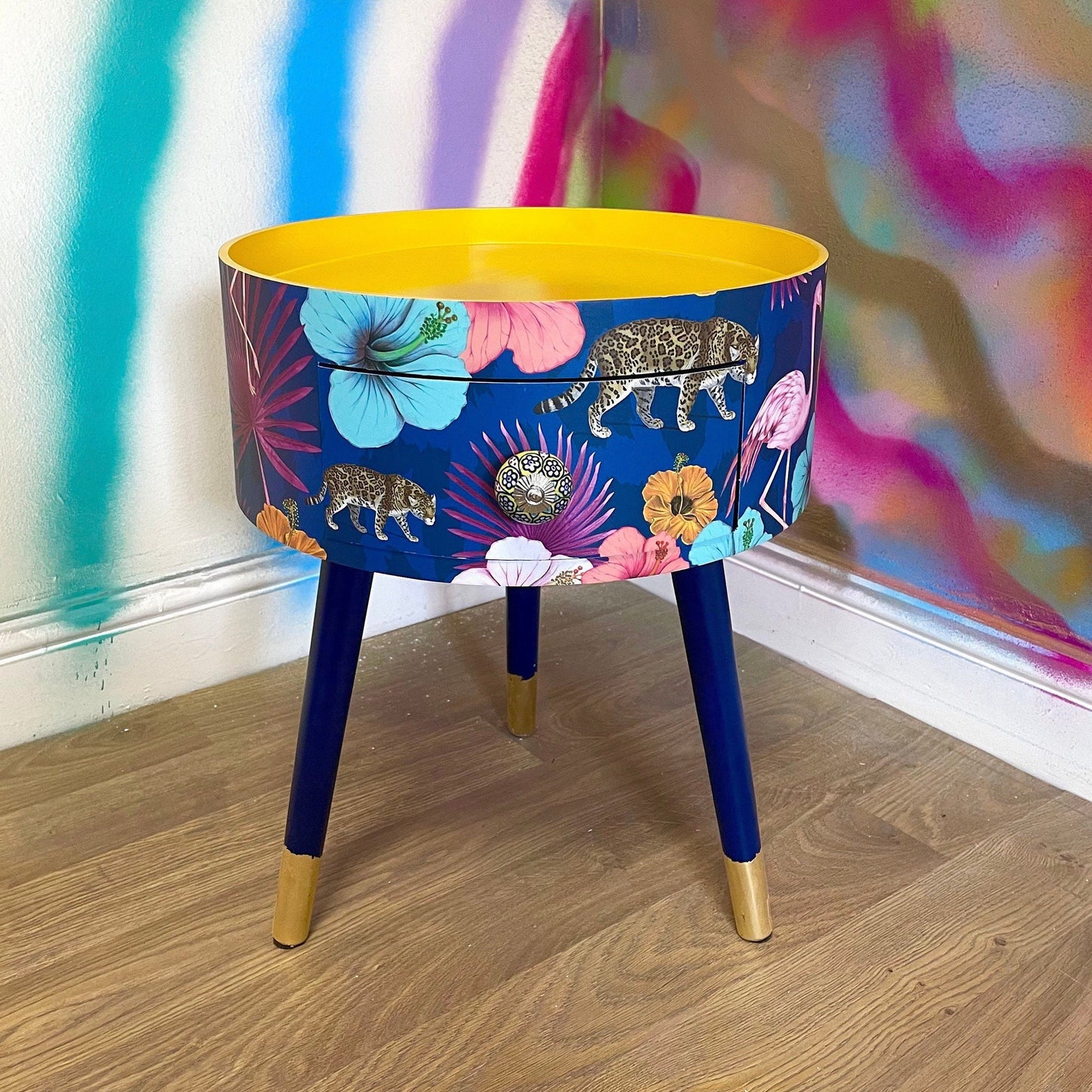 Flocking Fab - Navy Round bedside table with drawer, navy and yellow nightstand with tropical and leopard design.  Blue side table with storage, eclectic table