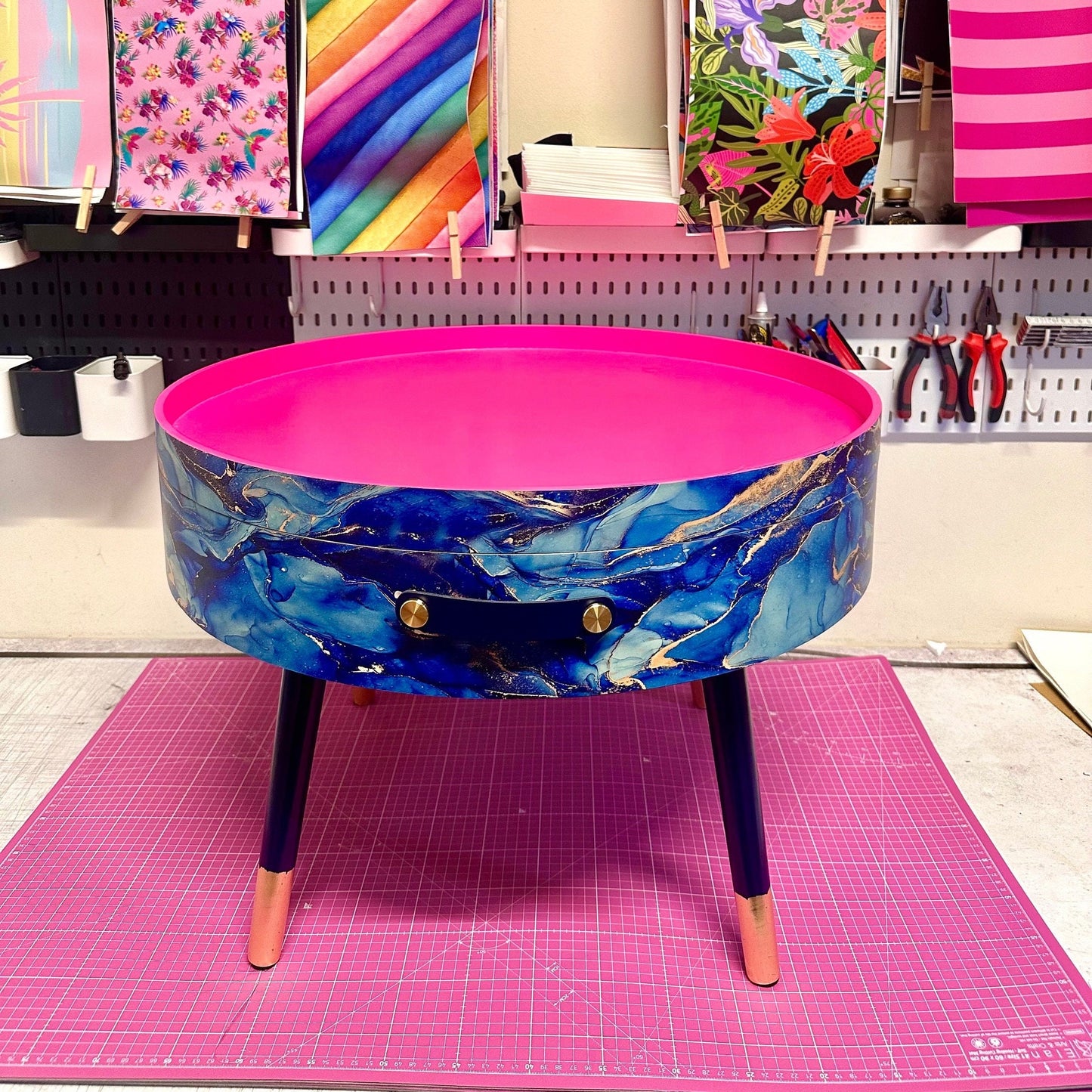 Round coffee table , blue and gold marble effect.  Navy blue and metallic effect. Hot pink, lift off top  storage. End table lounge