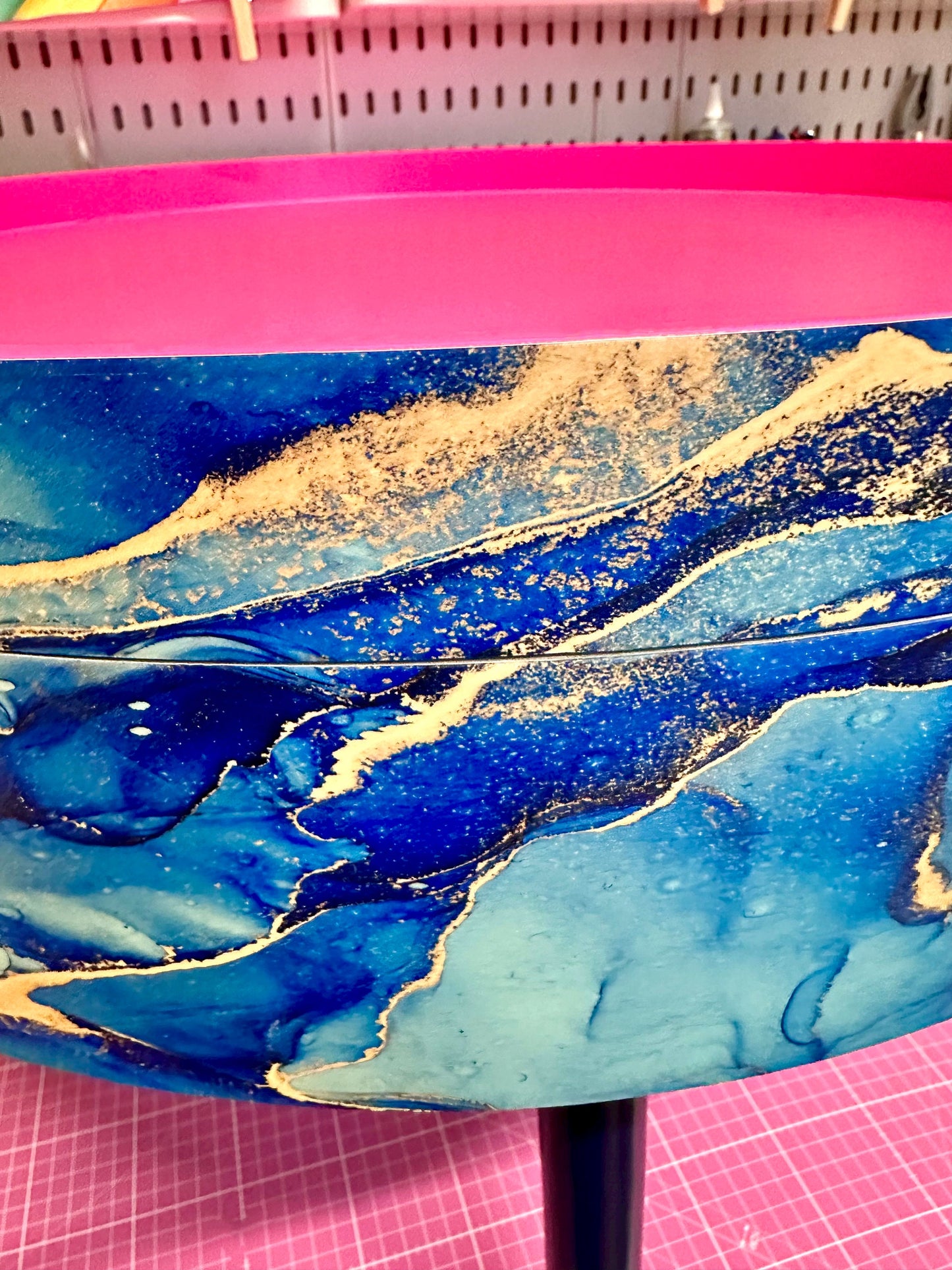 Round coffee table , blue and gold marble effect.  Navy blue and metallic effect. Hot pink, lift off top  storage. End table lounge