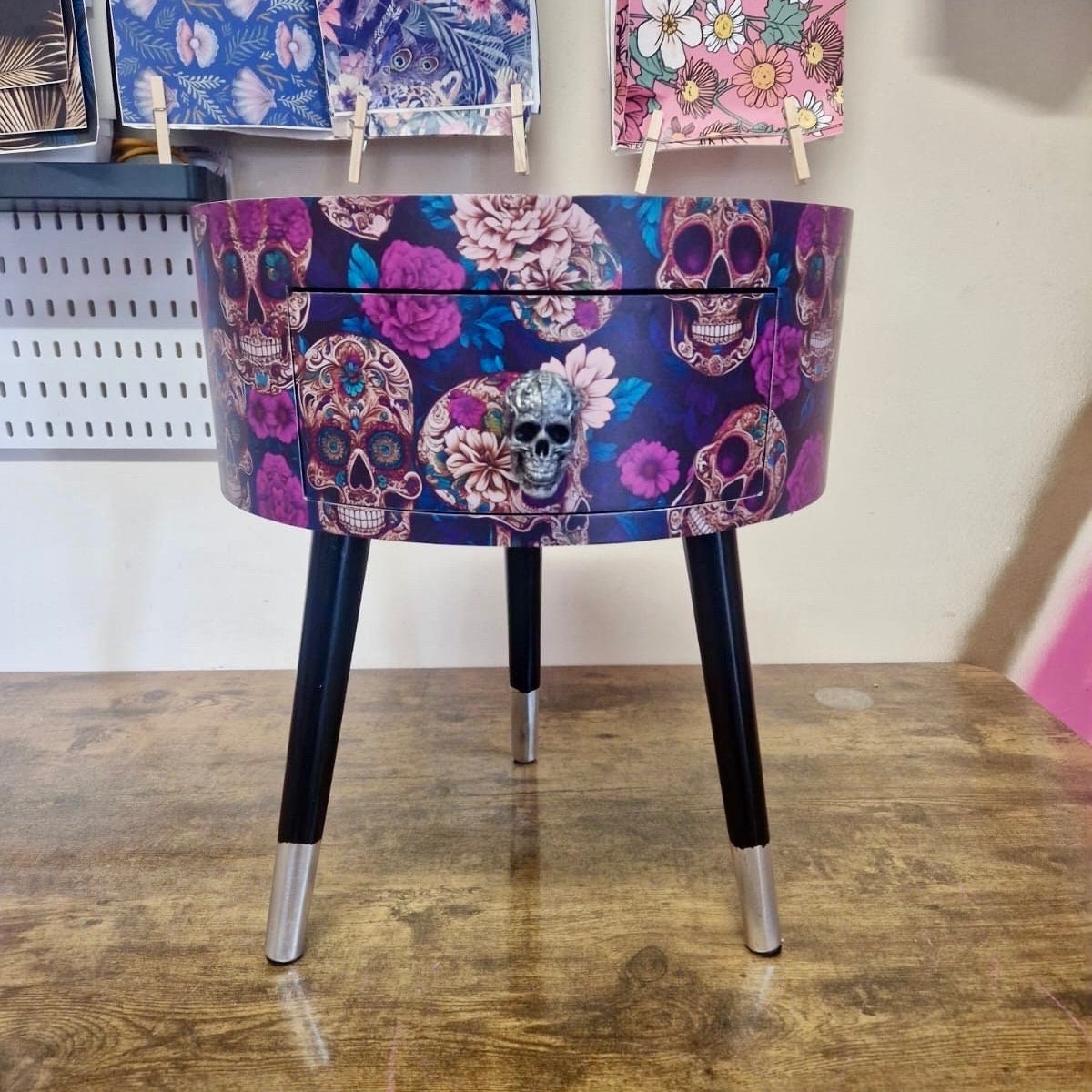 Skull design bedside table. Purple and black skull and roses, gothic inspired nightstand. Grey floral day of the dead end table