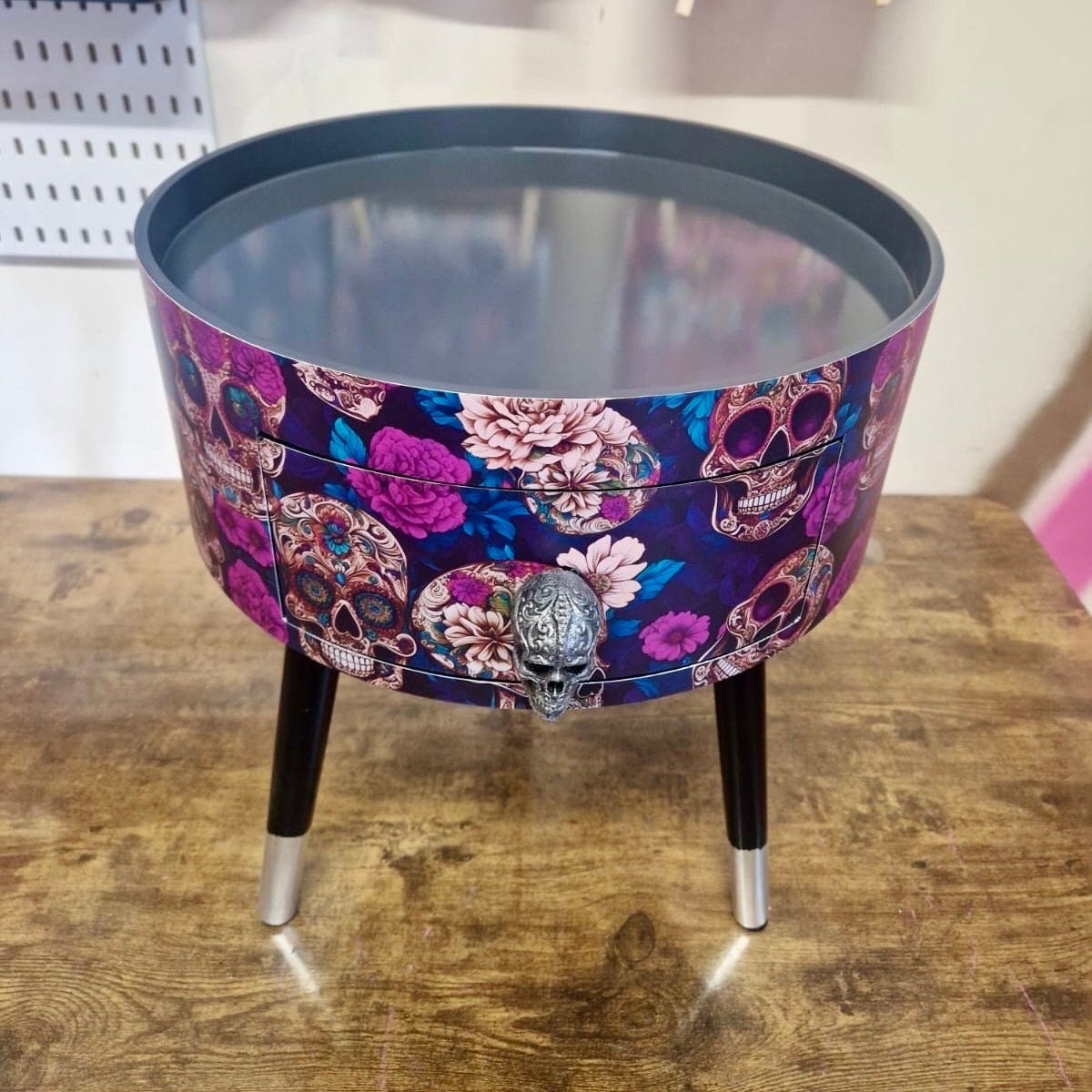 Skull design bedside table. Purple and black skull and roses, gothic inspired nightstand. Grey floral day of the dead end table