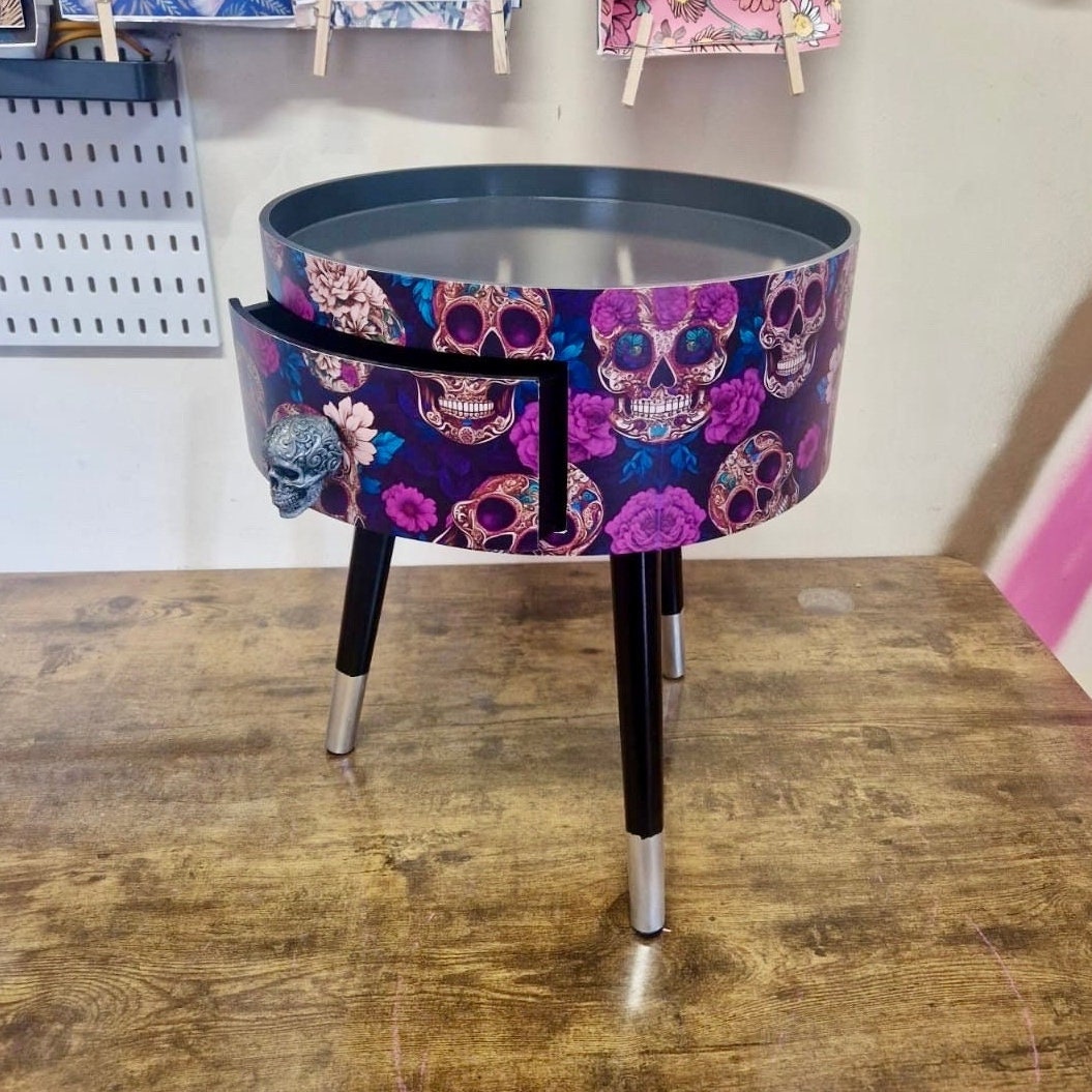 Skull design bedside table. Purple and black skull and roses, gothic inspired nightstand. Grey floral day of the dead end table