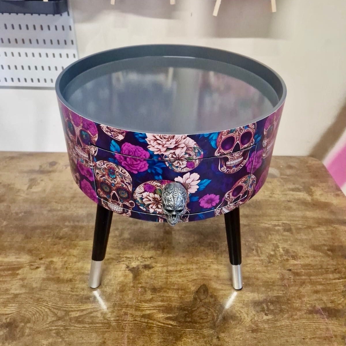 Skull design bedside table. Purple and black skull and roses, gothic inspired nightstand. Grey floral day of the dead end table