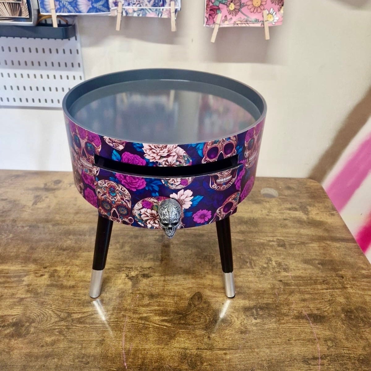 Skull design bedside table. Purple and black skull and roses, gothic inspired nightstand. Grey floral day of the dead end table