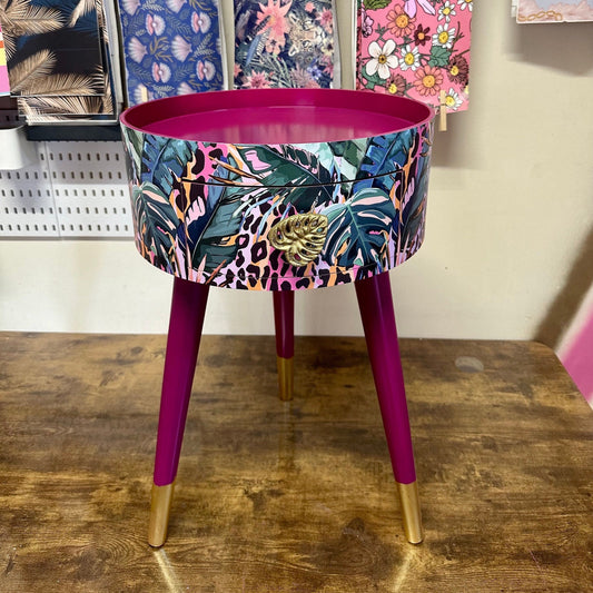 Leopard with Palm - Cherry blossom purple pink bedside table. Round wooden nightstand with leopard design in pinks, purples, greens. Cheetah end table with gold