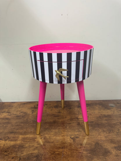 Black and white striped table with pink glitter top