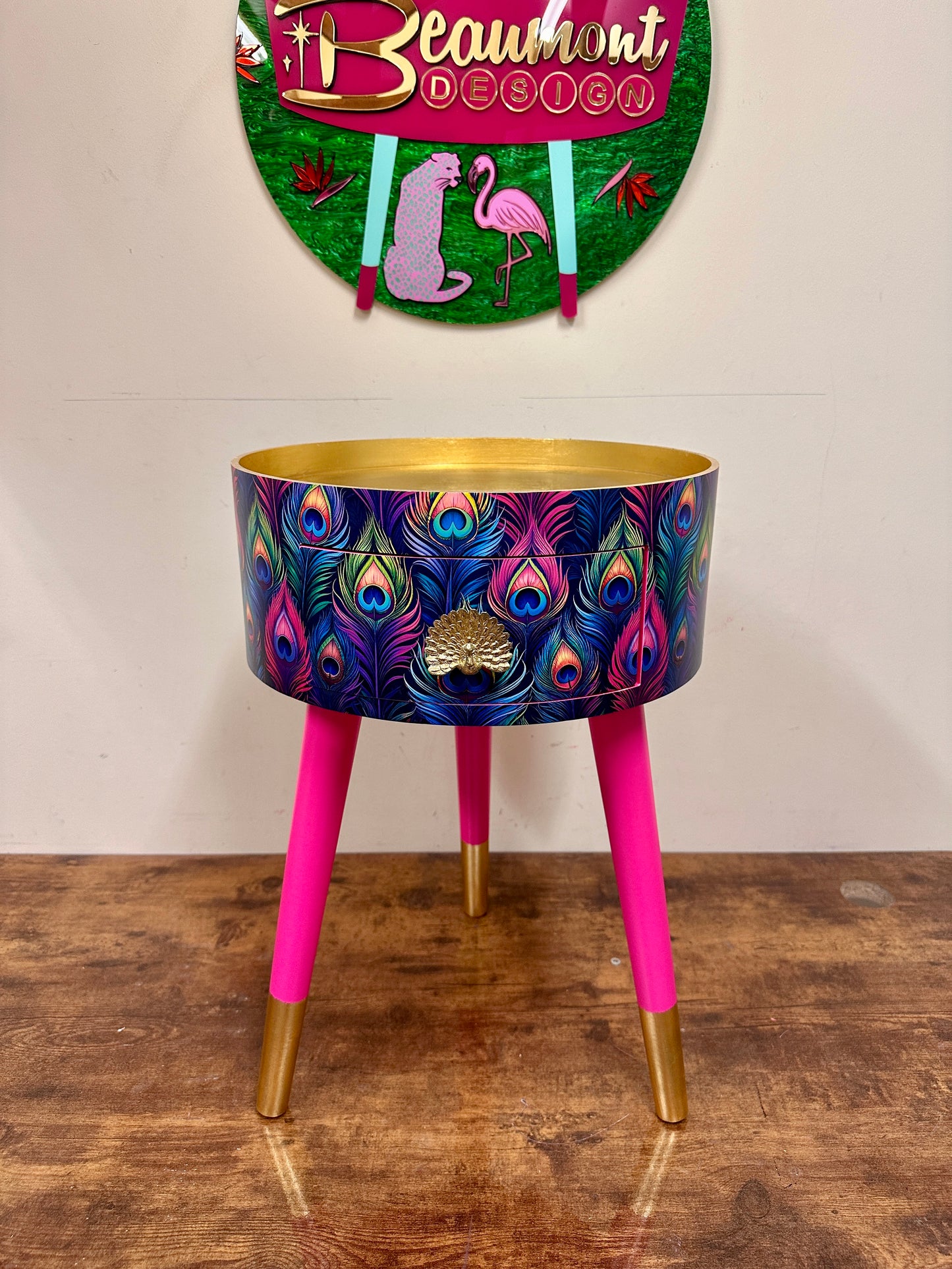 Colourful peacock table with gold leaf