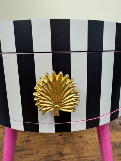 Striped table with pink legs
