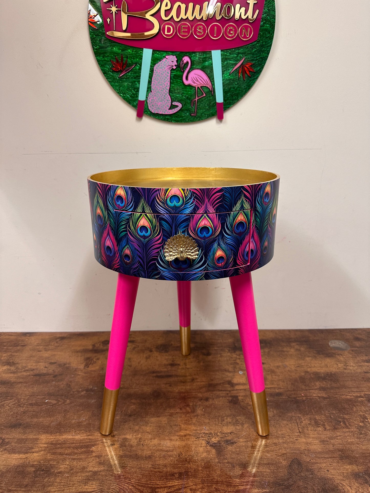Colourful peacock table with gold leaf