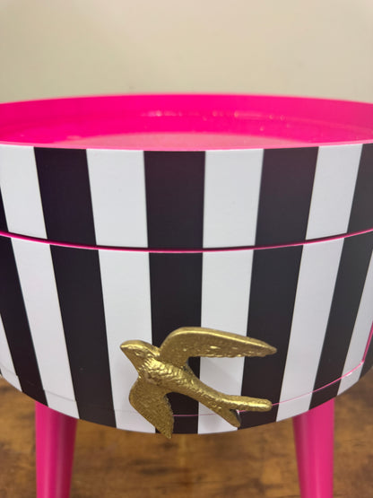 Black and white striped table with pink glitter top
