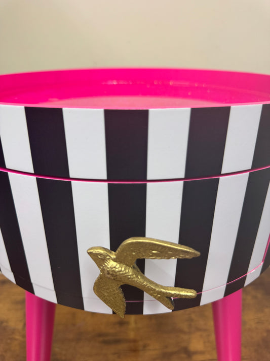 Black and white striped table with pink glitter top