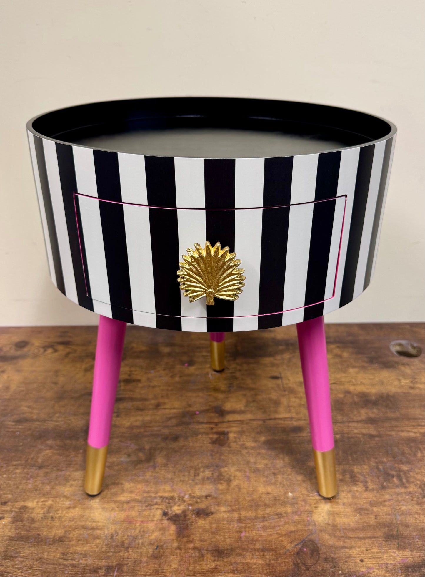 Striped table with pink legs