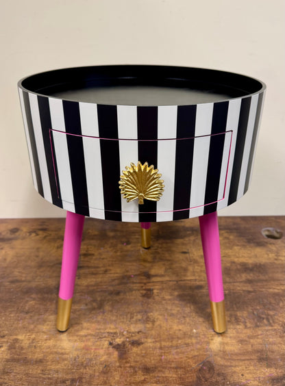 Striped table with pink legs