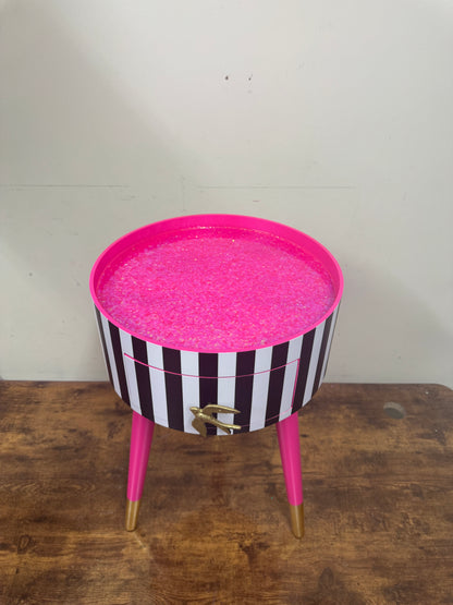 Black and white striped table with pink glitter top