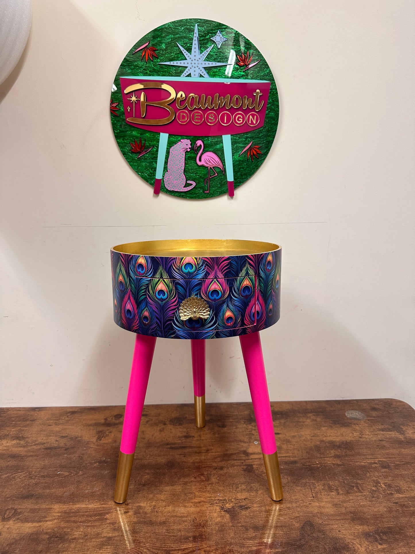 Colourful peacock table with gold leaf