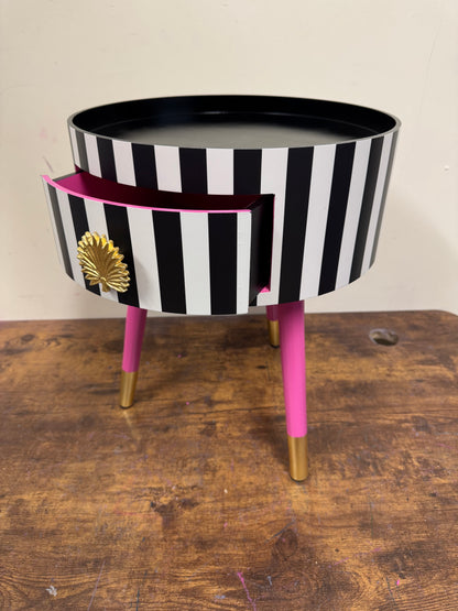 Striped table with pink legs