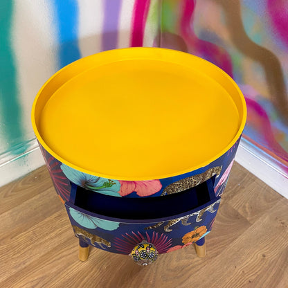 Flocking Fab - Navy Round bedside table with drawer, navy and yellow nightstand with tropical and leopard design.  Blue side table with storage, eclectic table