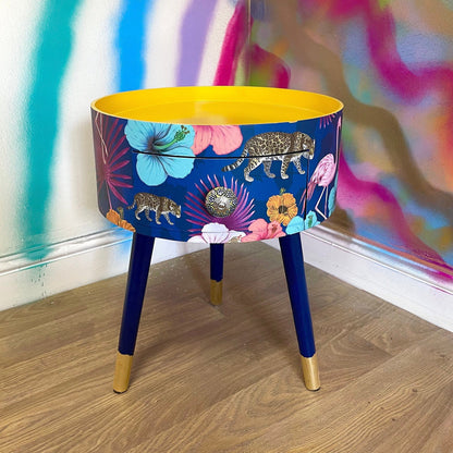 Flocking Fab - Navy Round bedside table with drawer, navy and yellow nightstand with tropical and leopard design.  Blue side table with storage, eclectic table