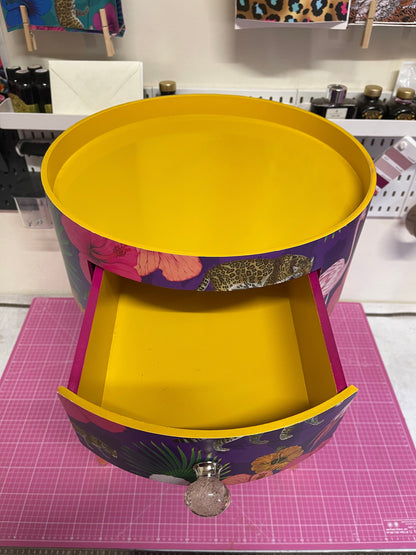 Flocking Fab - Purple side table. Round wooden table with drawer in purple yellow and pink tropical design. Personalised nightstand and side table.