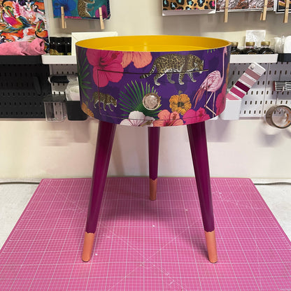 Flocking Fab - Purple side table. Round wooden table with drawer in purple yellow and pink tropical design. Personalised nightstand and side table.