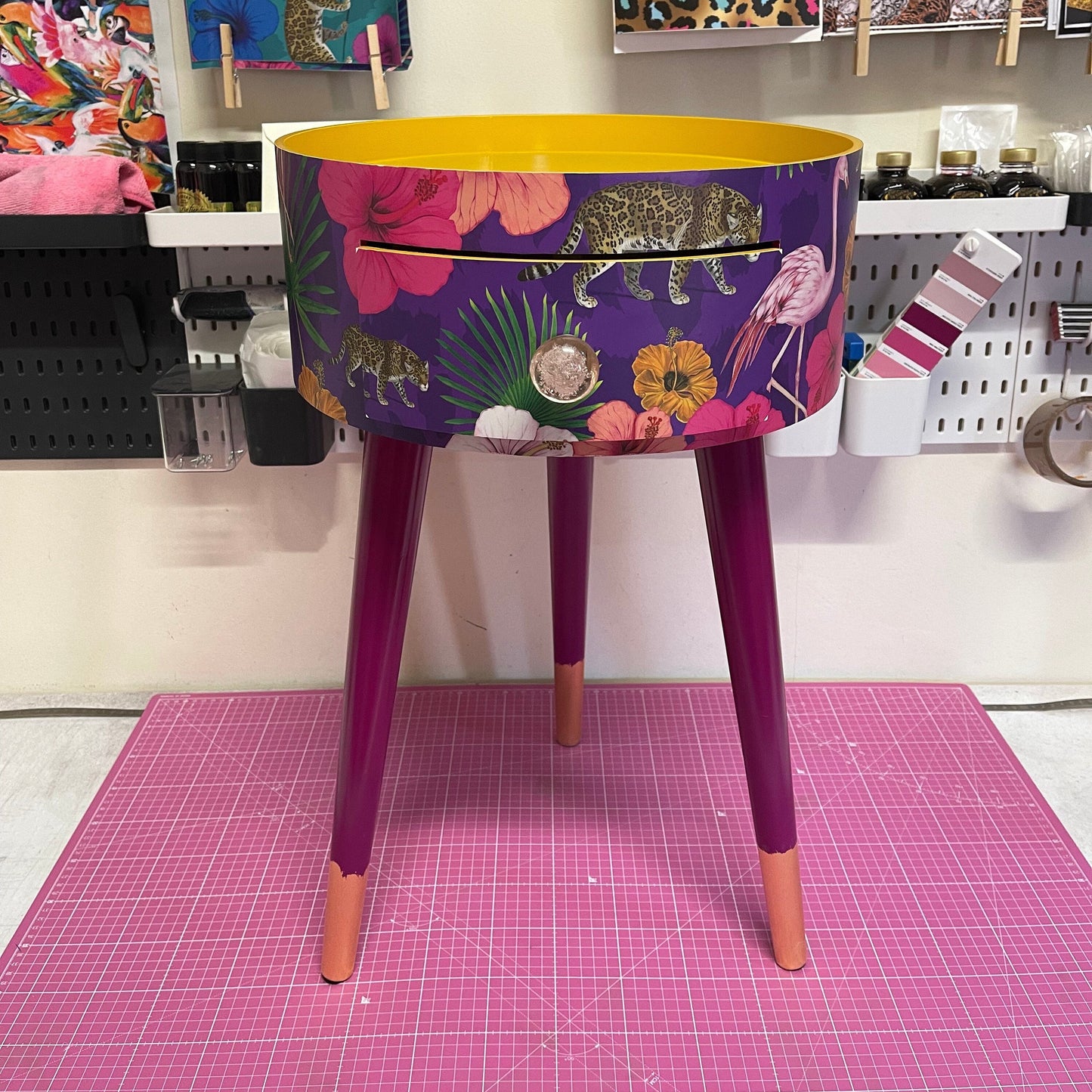 Flocking Fab - Purple side table. Round wooden table with drawer in purple yellow and pink tropical design. Personalised nightstand and side table.