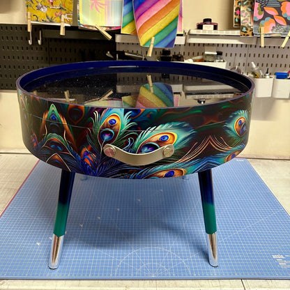 Round coffee table , peacock design, blue, teal  turquoise feathers. Navy Glitter . Round table, lift off top for storage. End table lounge
