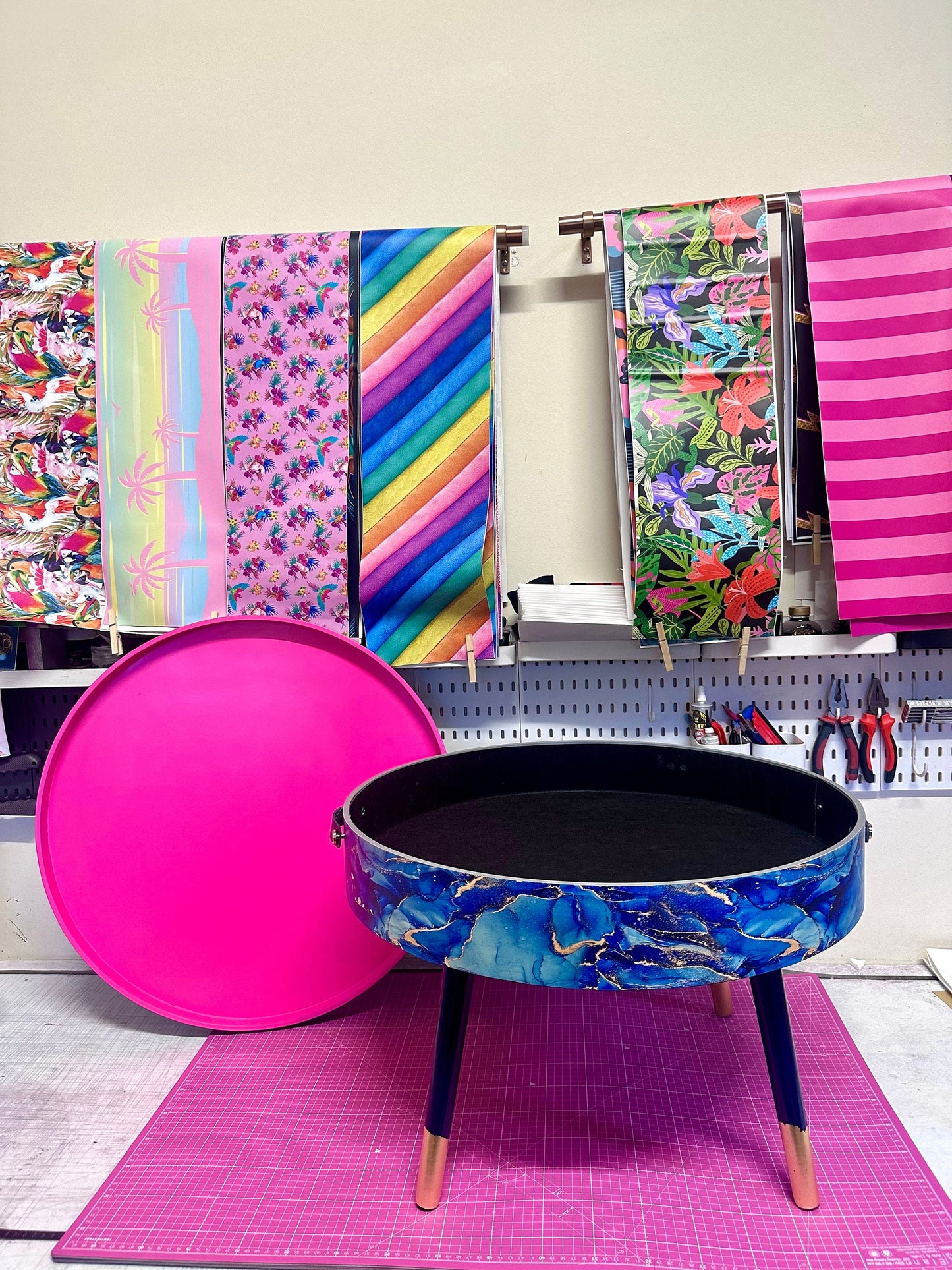 Round coffee table , blue and gold marble effect.  Navy blue and metallic effect. Hot pink, lift off top  storage. End table lounge