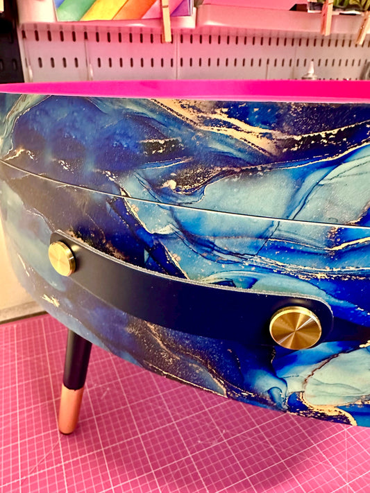 Round coffee table , blue and gold marble effect.  Navy blue and metallic effect. Hot pink, lift off top  storage. End table lounge