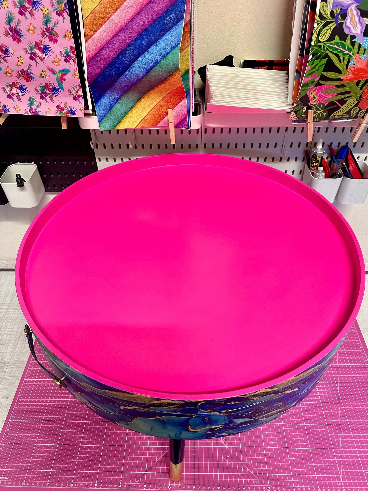 Round coffee table , blue and gold marble effect.  Navy blue and metallic effect. Hot pink, lift off top  storage. End table lounge