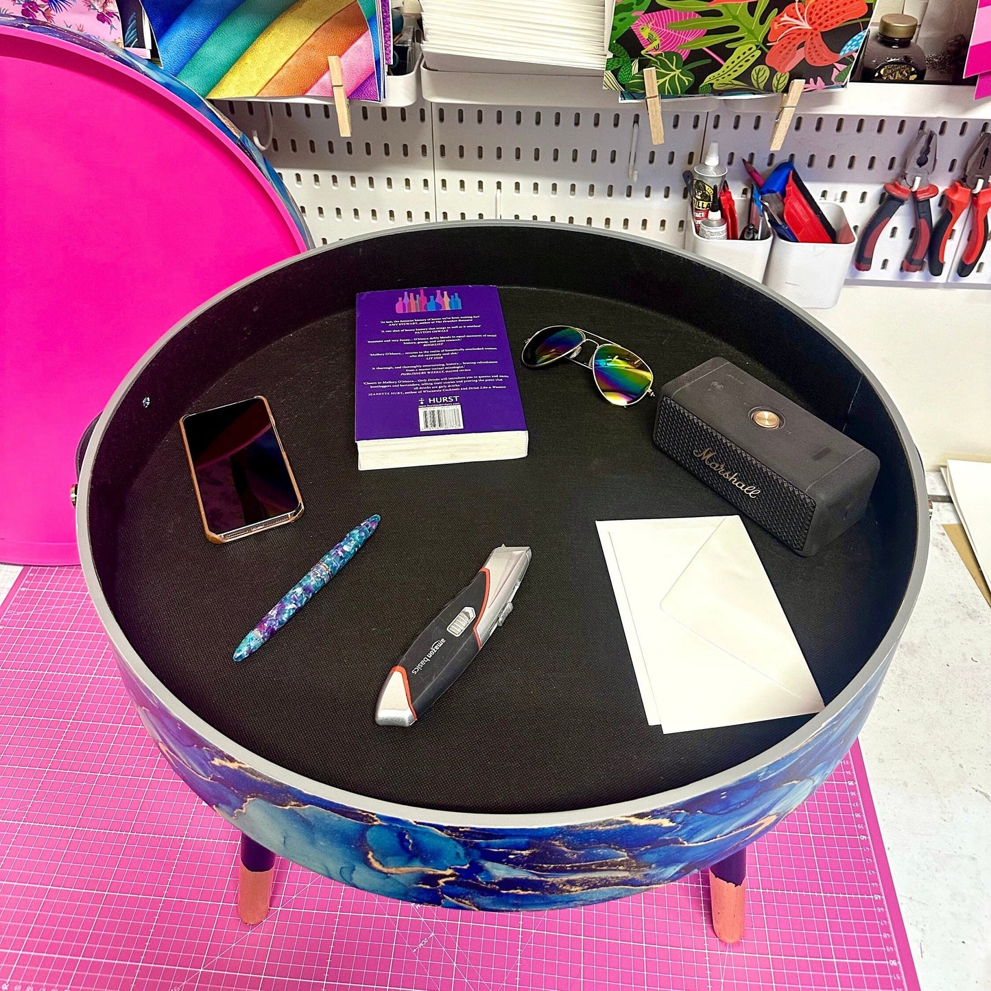 Round coffee table , blue and gold marble effect.  Navy blue and metallic effect. Hot pink, lift off top  storage. End table lounge