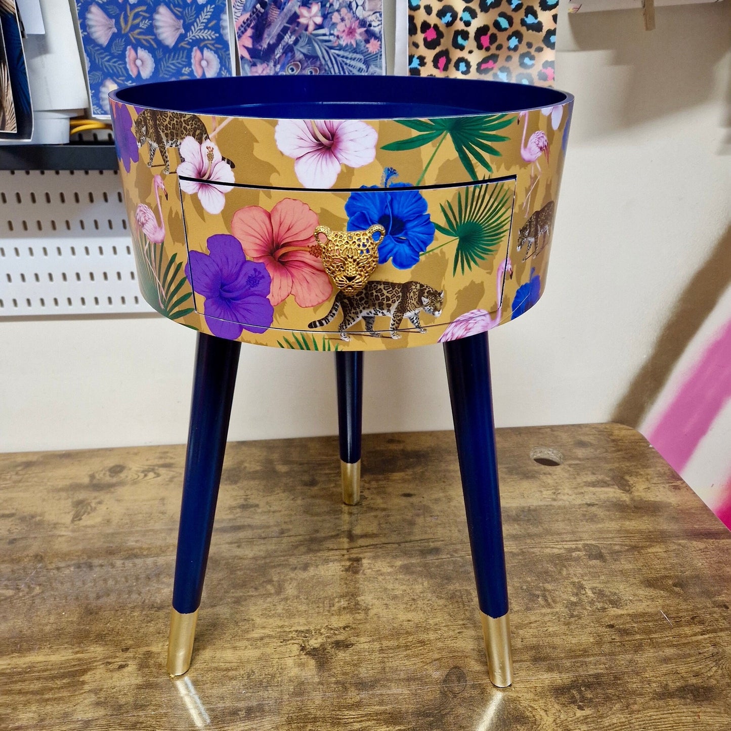 Flocking Fab - Yellow and navy round bedside table. Tropical design nightstand with flamingo and leopards. Cheetah and floral end table
