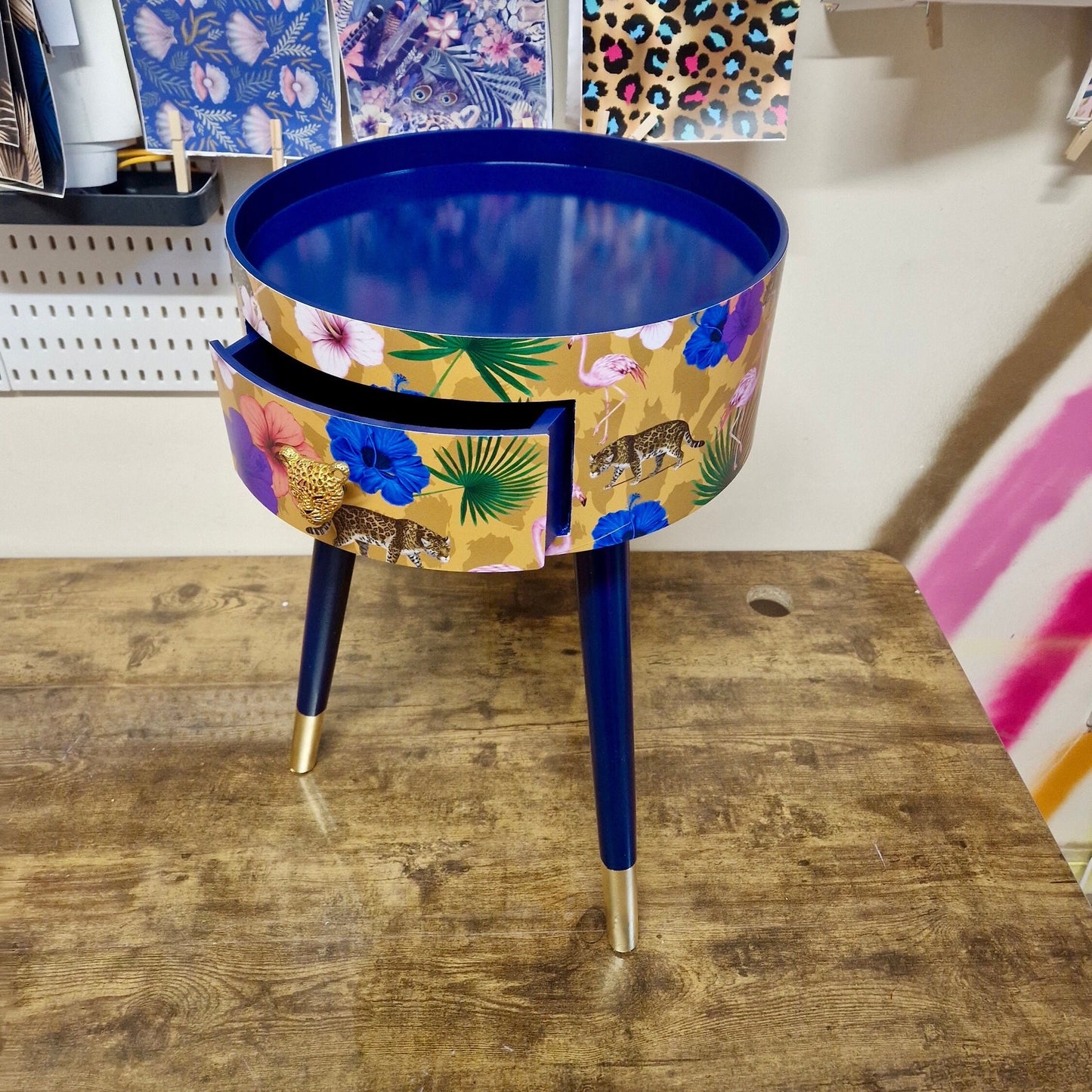 Flocking Fab - Yellow and navy round bedside table. Tropical design nightstand with flamingo and leopards. Cheetah and floral end table