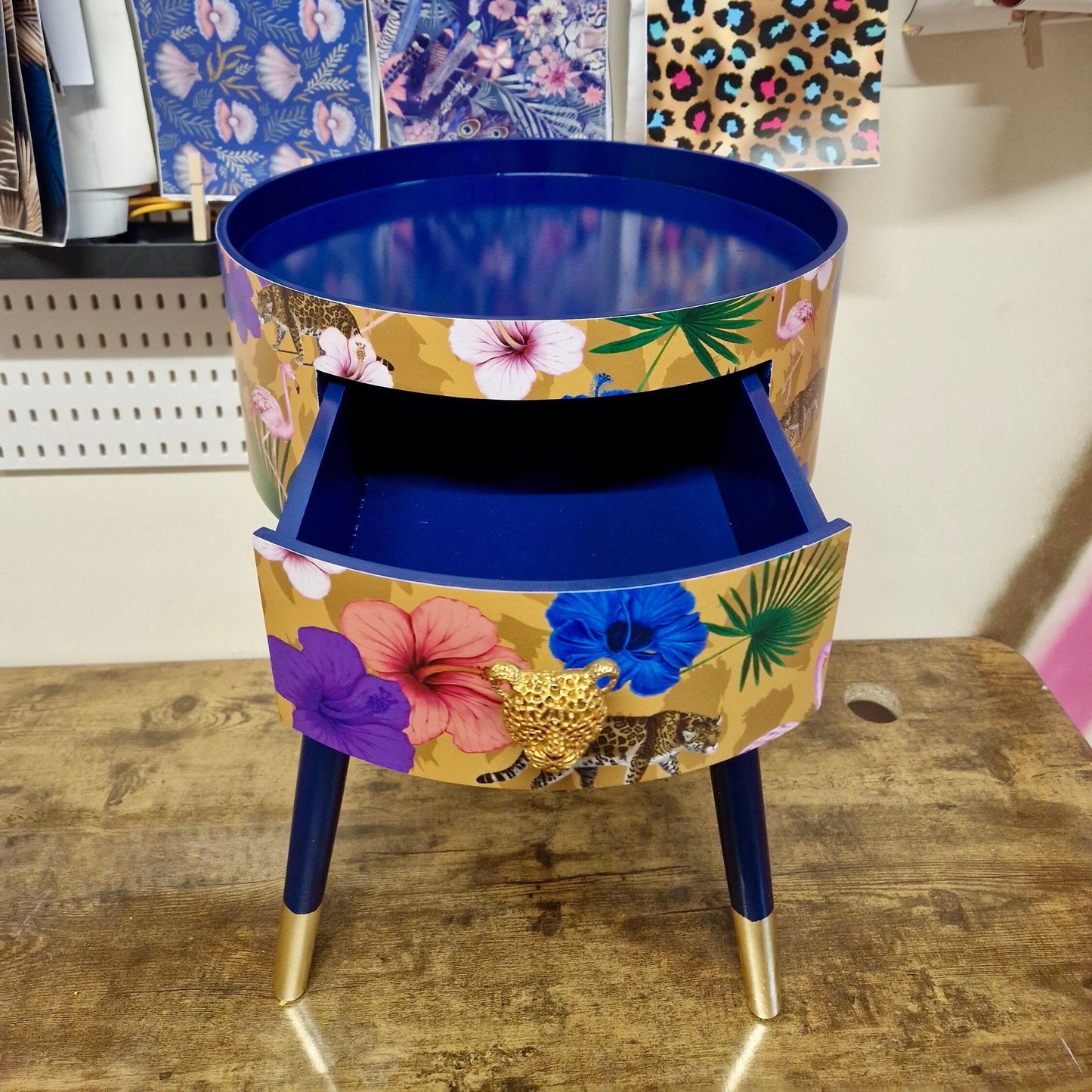 Flocking Fab - Yellow and navy round bedside table. Tropical design nightstand with flamingo and leopards. Cheetah and floral end table
