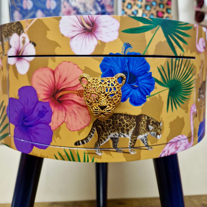 Flocking Fab - Yellow and navy round bedside table. Tropical design nightstand with flamingo and leopards. Cheetah and floral end table