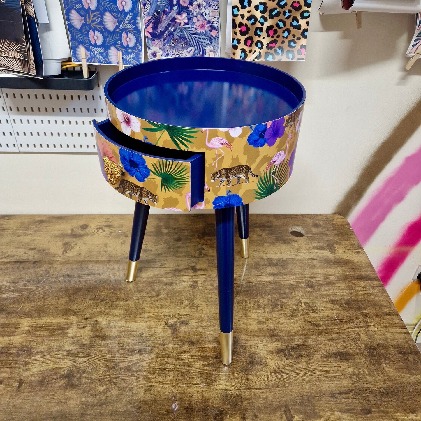 Flocking Fab - Yellow and navy round bedside table. Tropical design nightstand with flamingo and leopards. Cheetah and floral end table