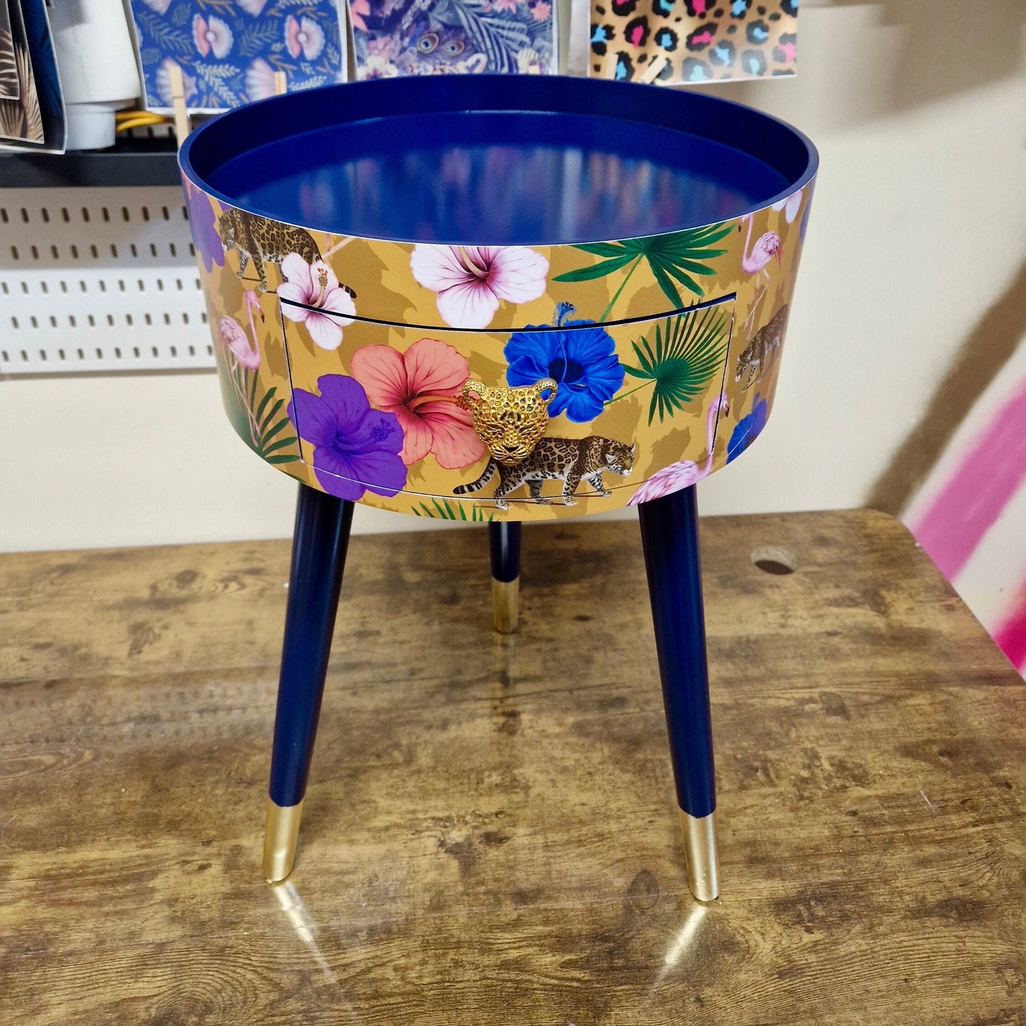 Flocking Fab - Yellow and navy round bedside table. Tropical design nightstand with flamingo and leopards. Cheetah and floral end table