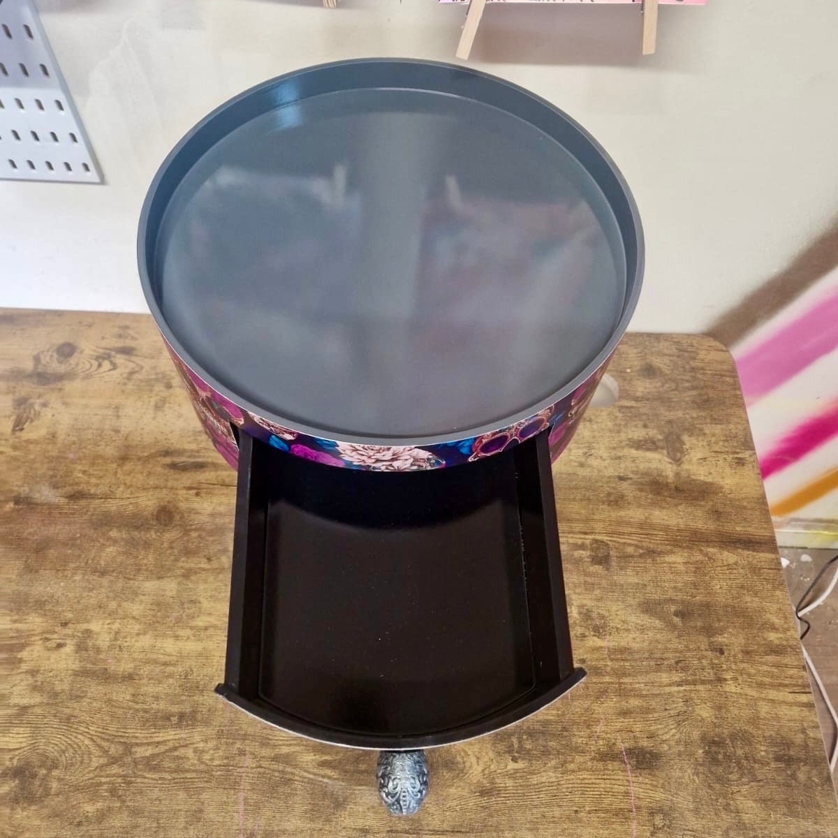 Skull design bedside table. Purple and black skull and roses, gothic inspired nightstand. Grey floral day of the dead end table