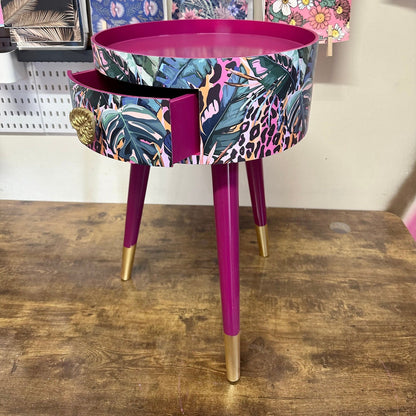 Leopard with Palm - Cherry blossom purple pink bedside table. Round wooden nightstand with leopard design in pinks, purples, greens. Cheetah end table with gold