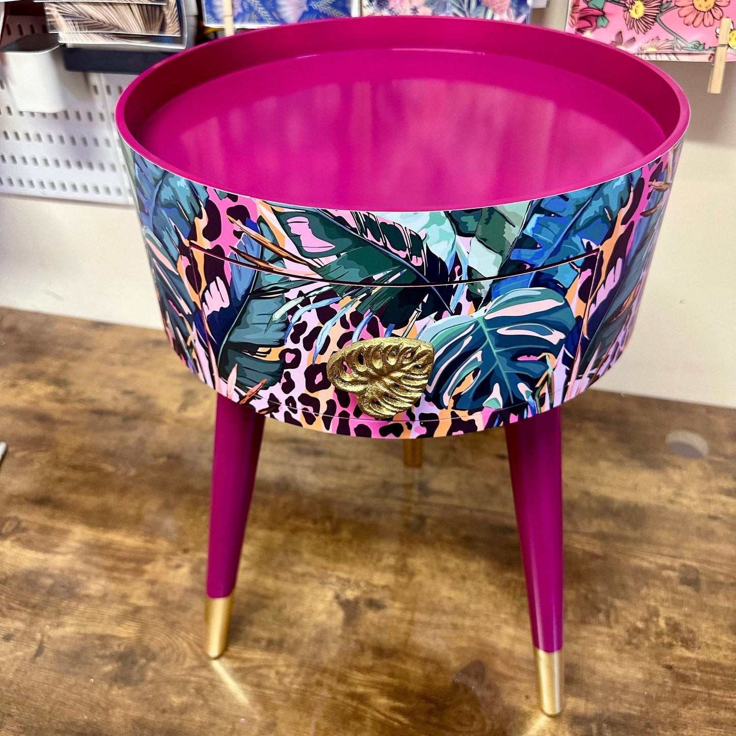 Leopard with Palm - Cherry blossom purple pink bedside table. Round wooden nightstand with leopard design in pinks, purples, greens. Cheetah end table with gold