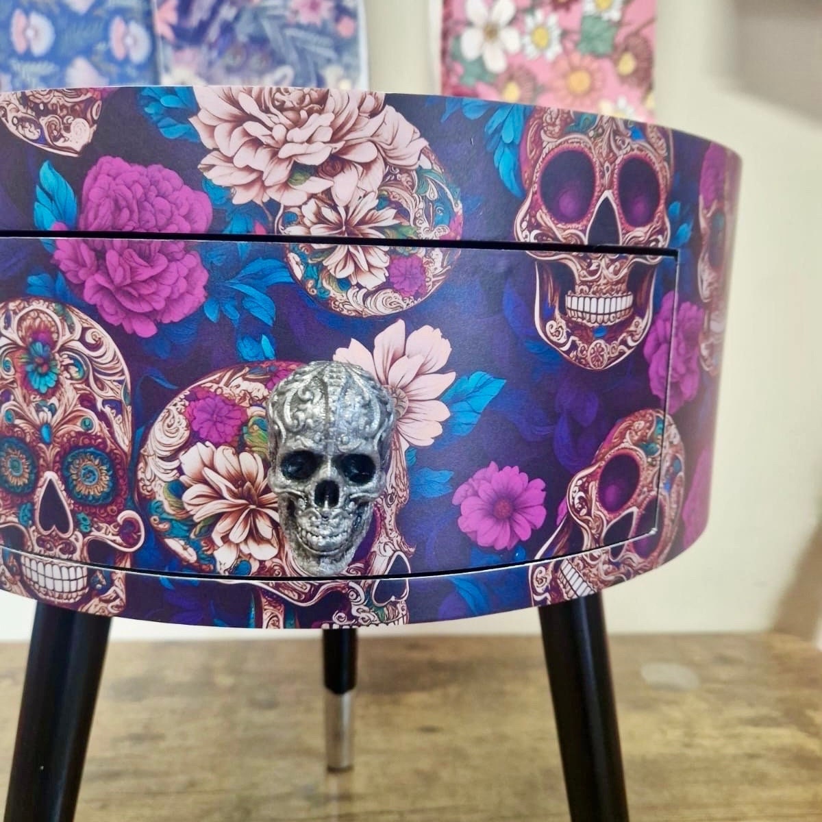 Skull design bedside table. Purple and black skull and roses, gothic inspired nightstand. Grey floral day of the dead end table