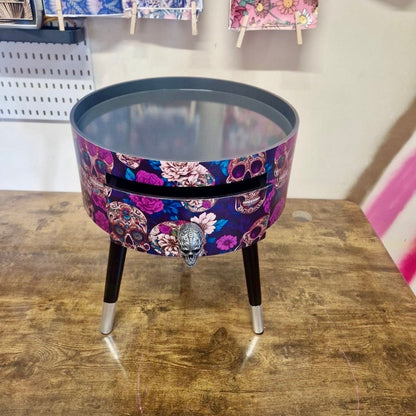 Skull design bedside table. Purple and black skull and roses, gothic inspired nightstand. Grey floral day of the dead end table