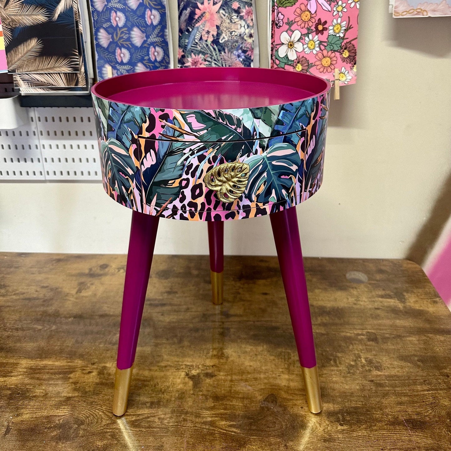 Leopard with Palm - Cherry blossom purple pink bedside table. Round wooden nightstand with leopard design in pinks, purples, greens. Cheetah end table with gold